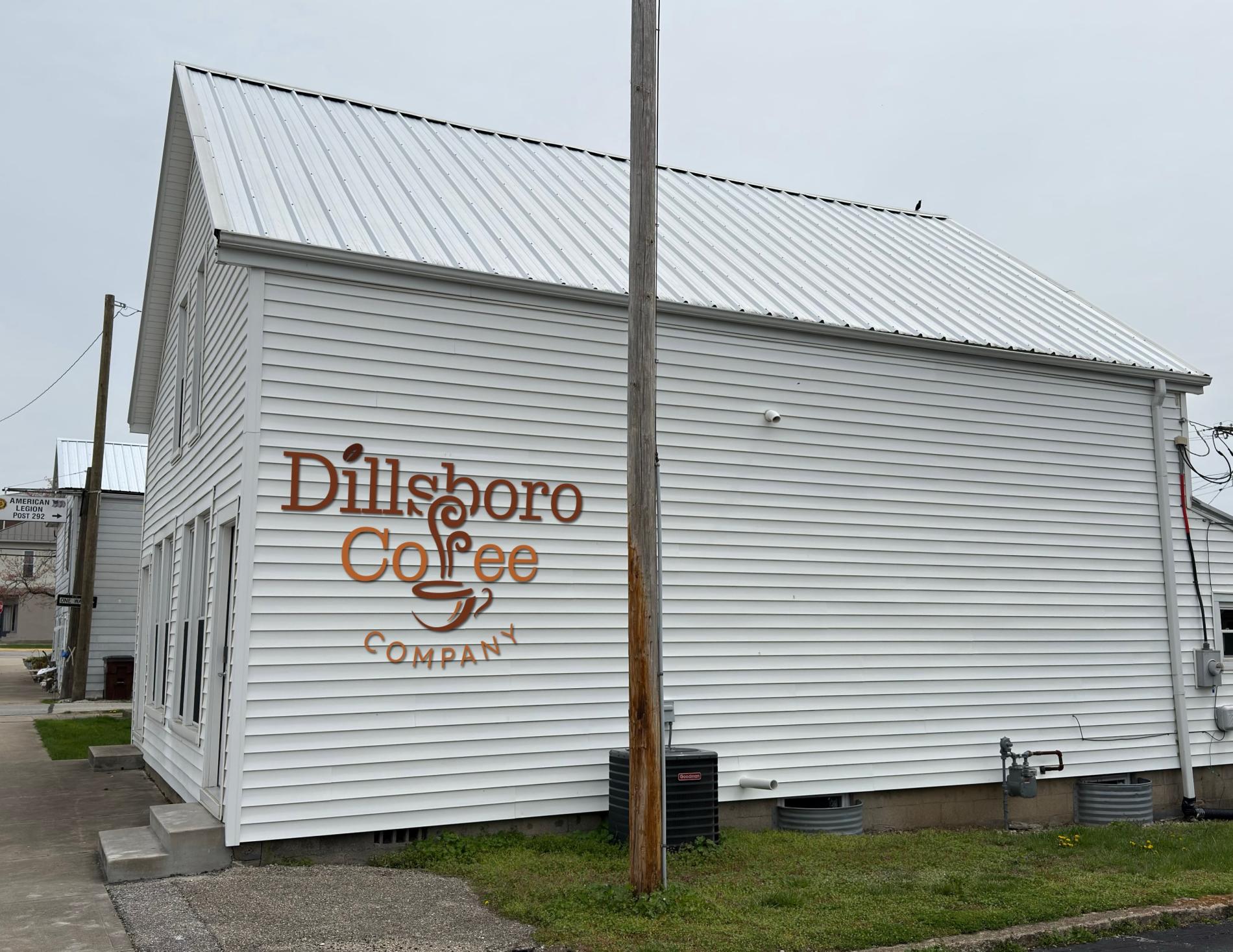 White building with a sign for Dillsboro Coffee Co.
